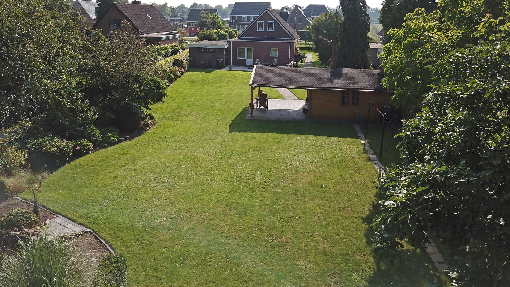 Te koop in Drenthe: vrijstaande woning met ruime tuin en blokhut met veranda